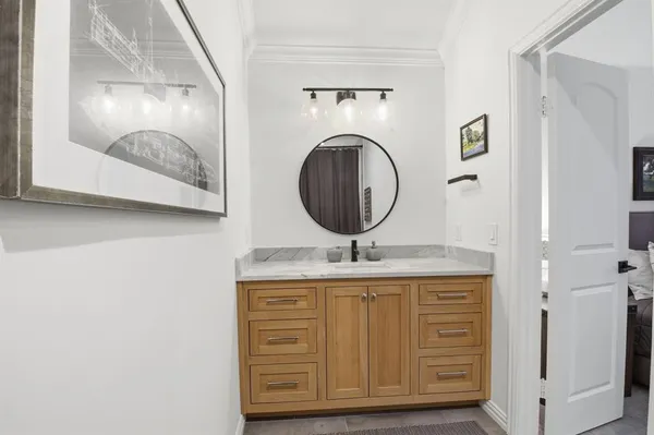 a bathroom with a sink and a mirror