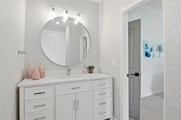 a bathroom with a sink and a mirror