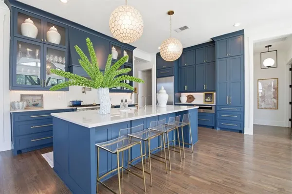 a kitchen with a table and chairs in it
