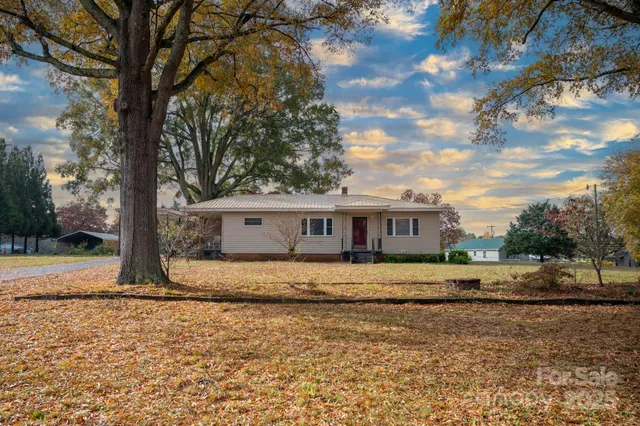 a house that has tree in front of it
