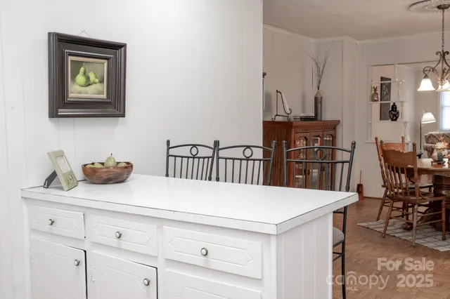 a kitchen with a table and chairs
