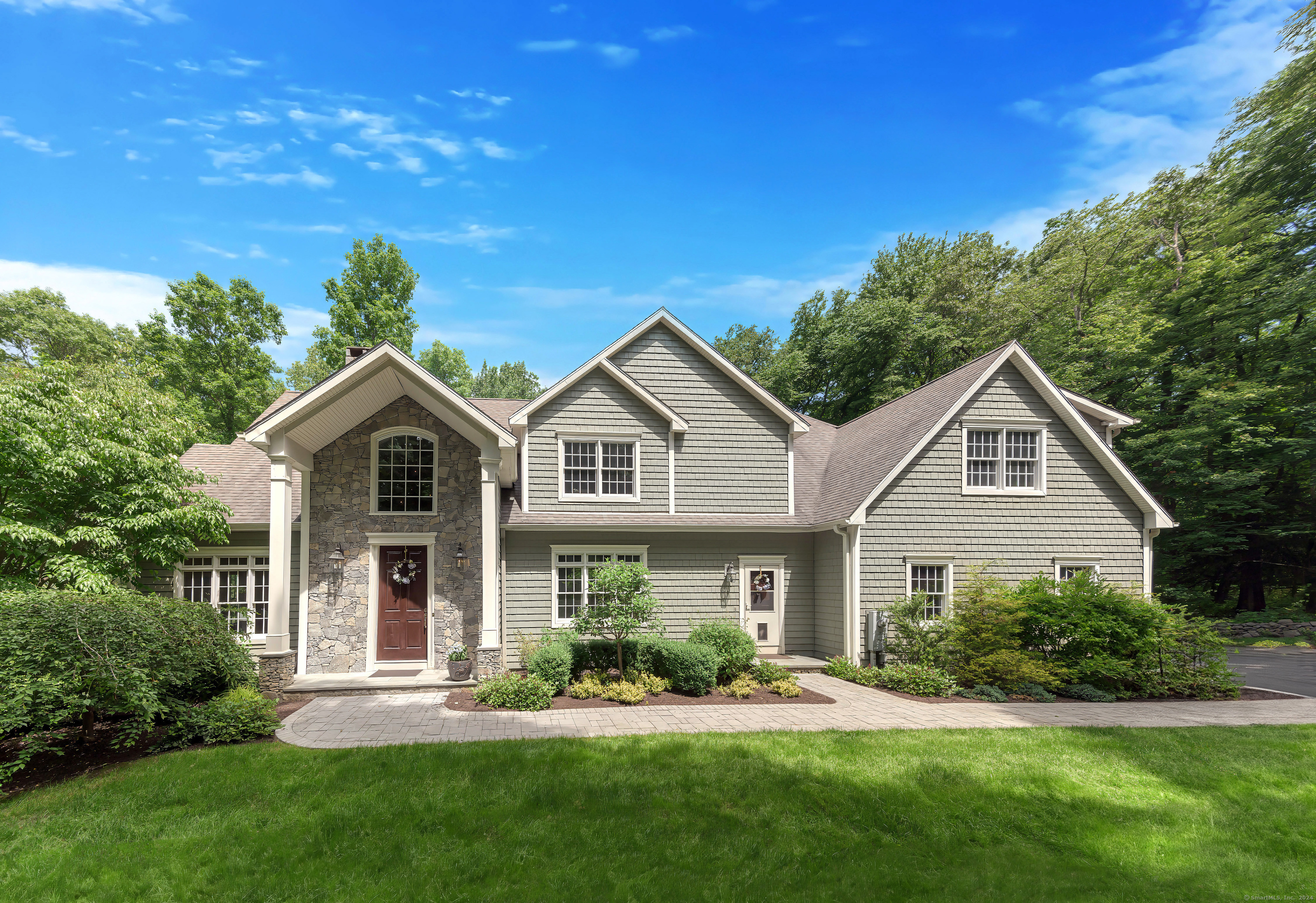 99 Old Stagecoach Road Redding, CT 06896 - Photo 1 of 1 a front view of a house with a yard