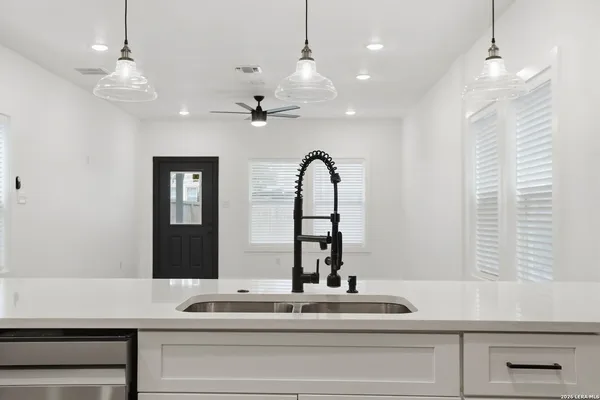 a open kitchen with kitchen island stainless steel appliances and living room view