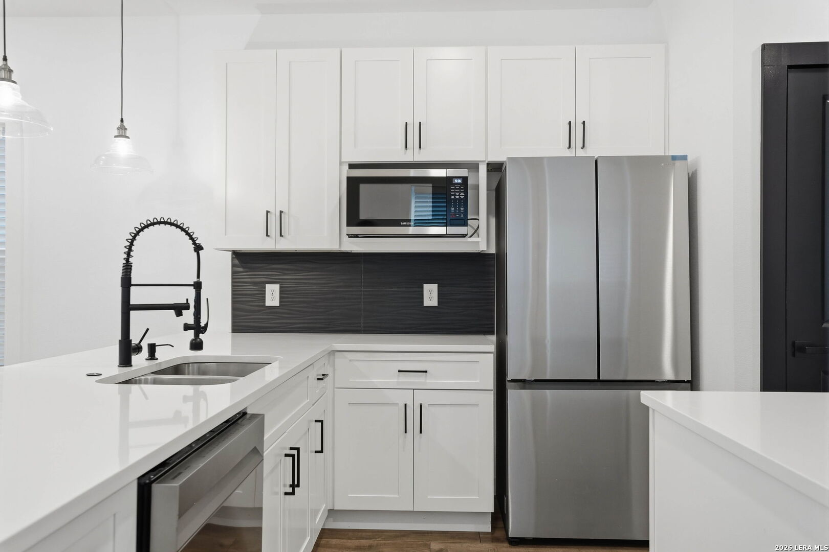 317 Porter Street San Antonio, TX 78210 - Photo 13 of 40 a kitchen with appliances a sink and cabinets