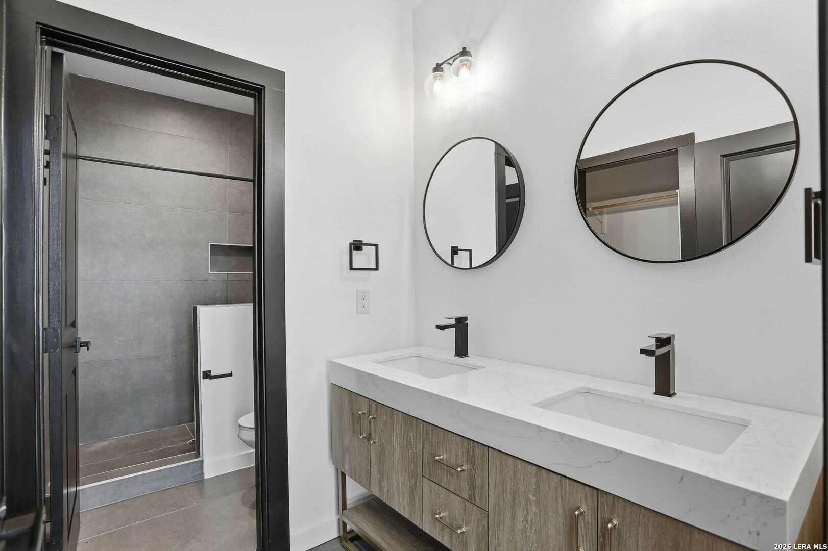 317 Porter Street San Antonio, TX 78210 - Photo 24 of 40 a bathroom with a sink and a mirror