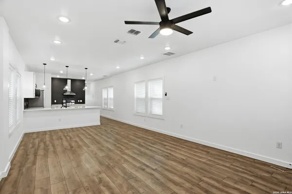 a view of a kitchen with a dishwasher and a window