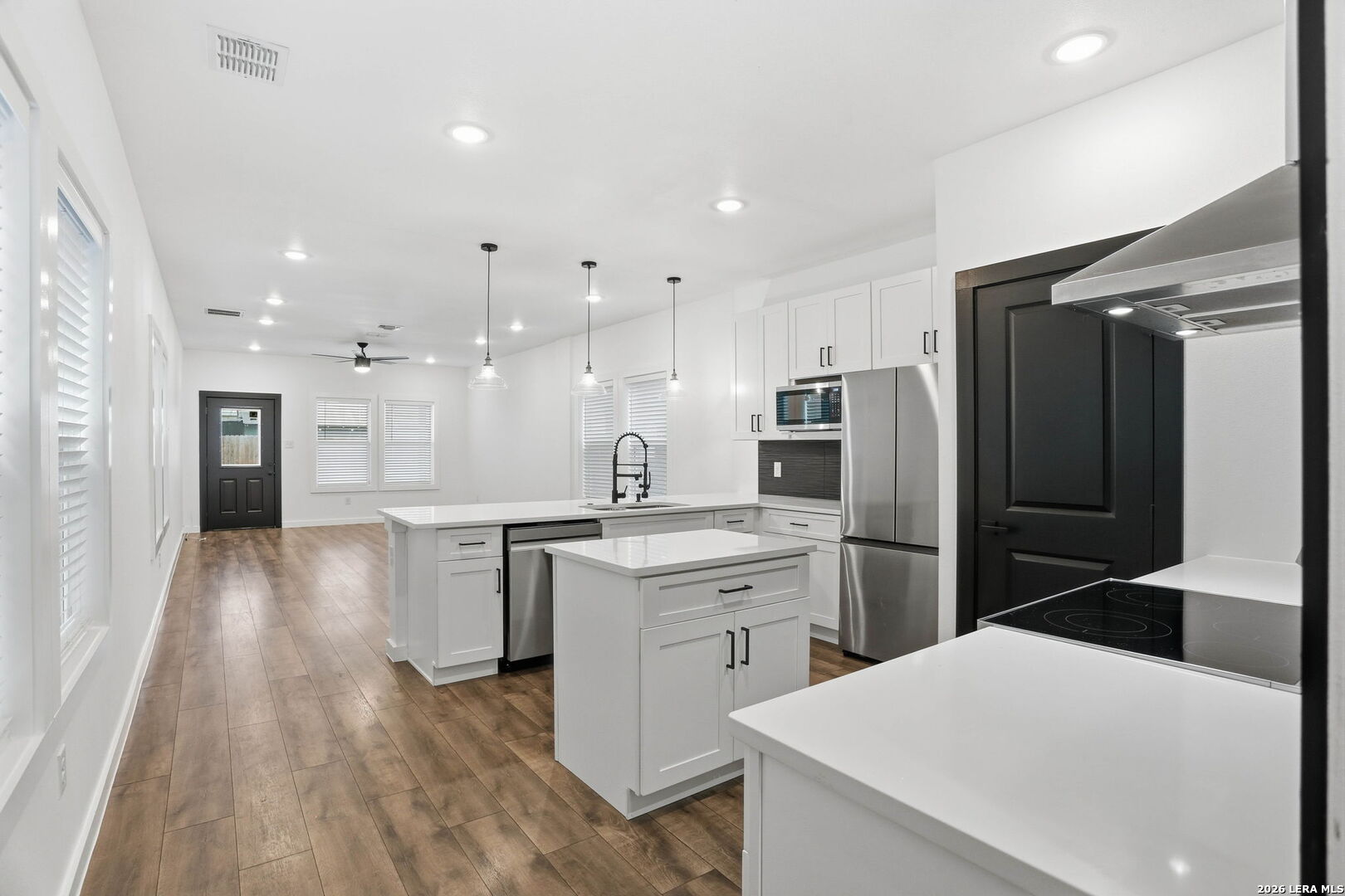 317 Porter Street San Antonio, TX 78210 - Photo 9 of 40 a kitchen with a refrigerator a sink and cabinets