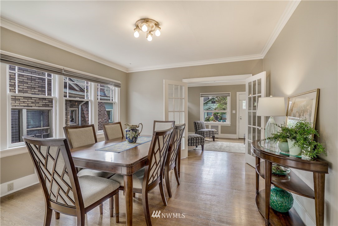 548 North 68th Street Seattle, WA 98103 - Photo 4 of 20 a view of a dining room with furniture and wooden floor
