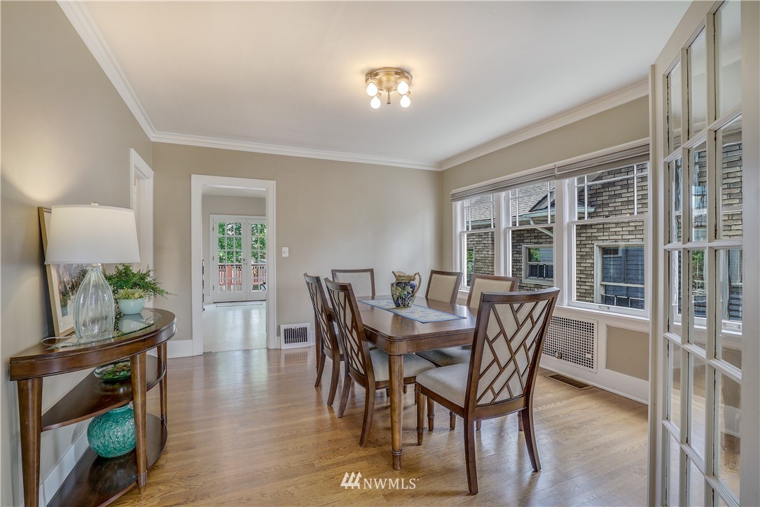 548 North 68th Street Seattle, WA 98103 - Photo 5 of 20 a dining room with furniture and wooden floor