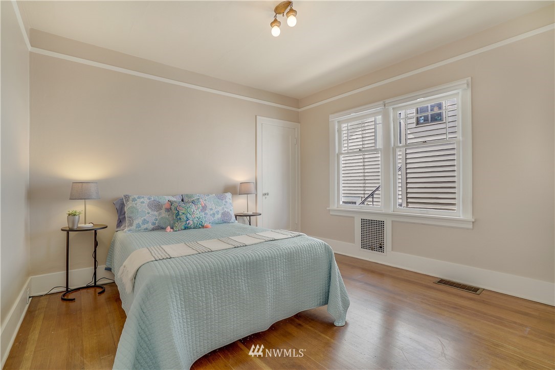 548 North 68th Street Seattle, WA 98103 - Photo 9 of 20 a bedroom with a bed and a window