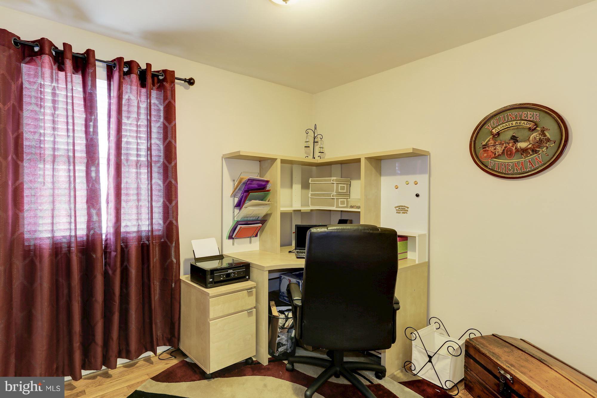 12503 Feldon Street Silver Spring, MD 20906 - Photo 12 of 18 a view of a workspace with furniture and a window