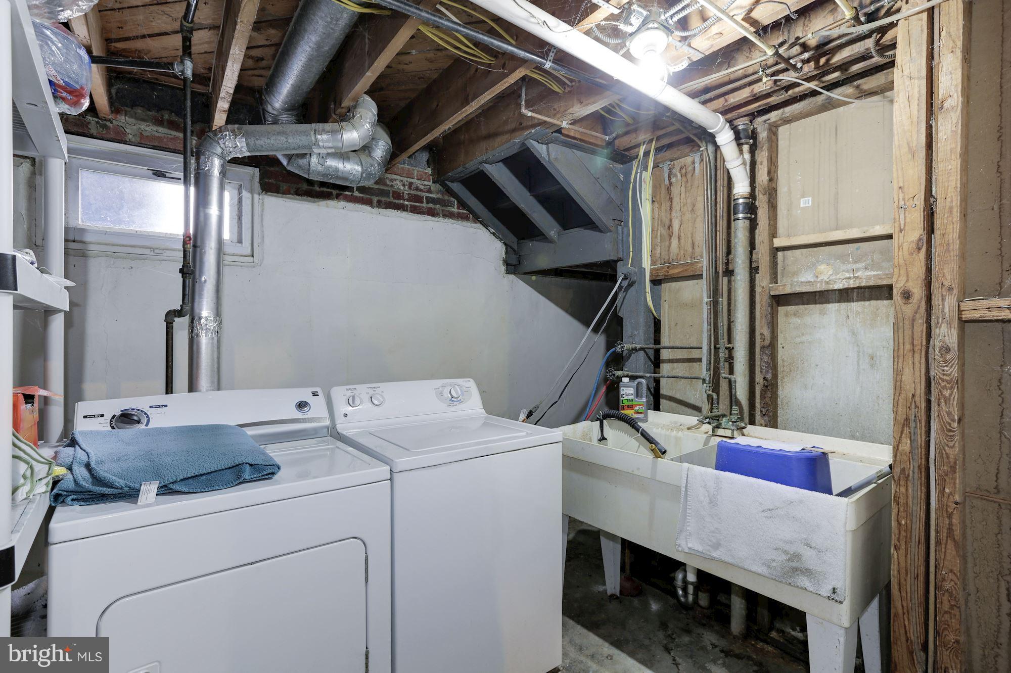 12503 Feldon Street Silver Spring, MD 20906 - Photo 17 of 18 a utility room with dryer and washer