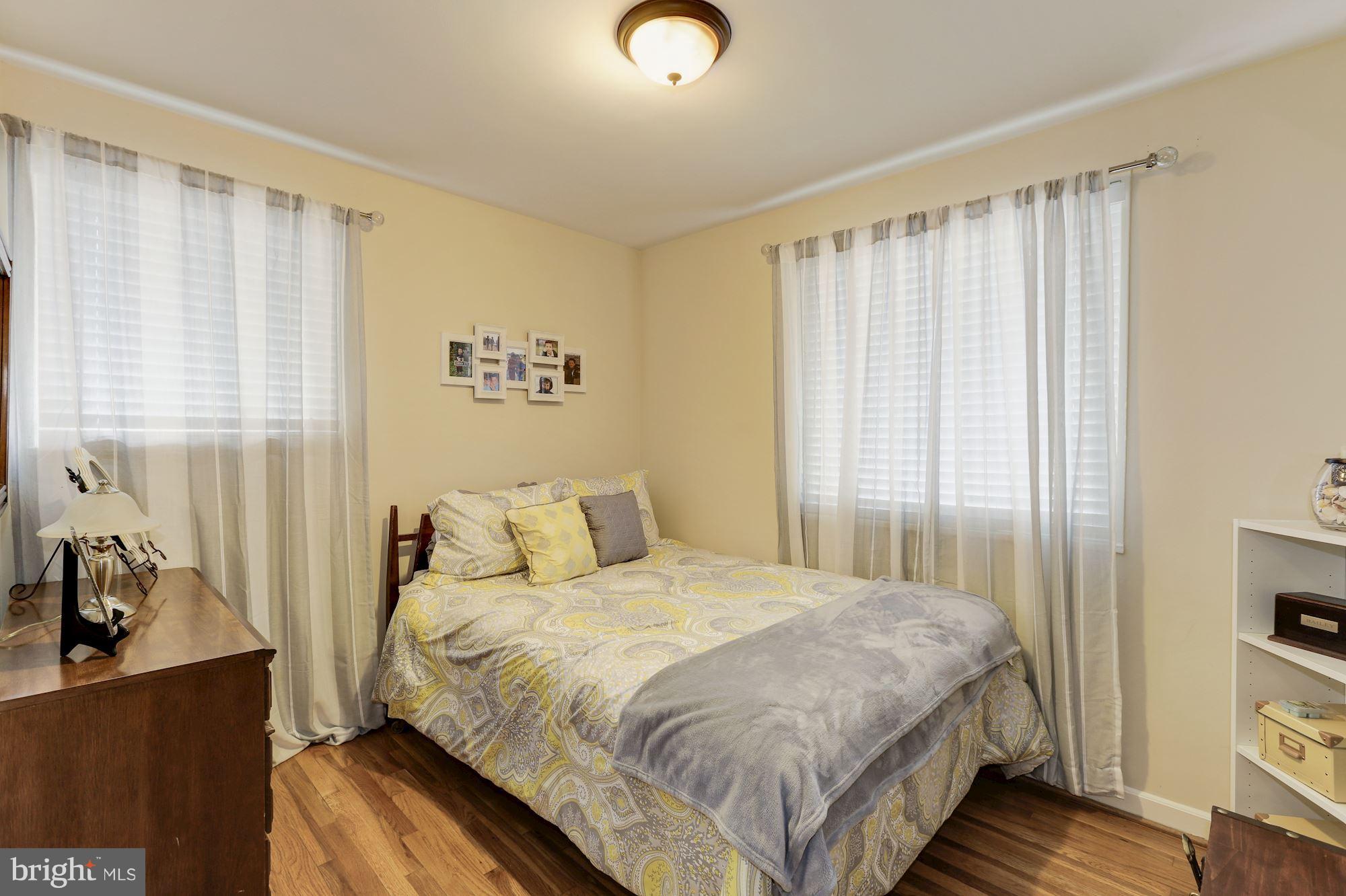 12503 Feldon Street Silver Spring, MD 20906 - Photo 9 of 18 a bedroom with a bed and a window