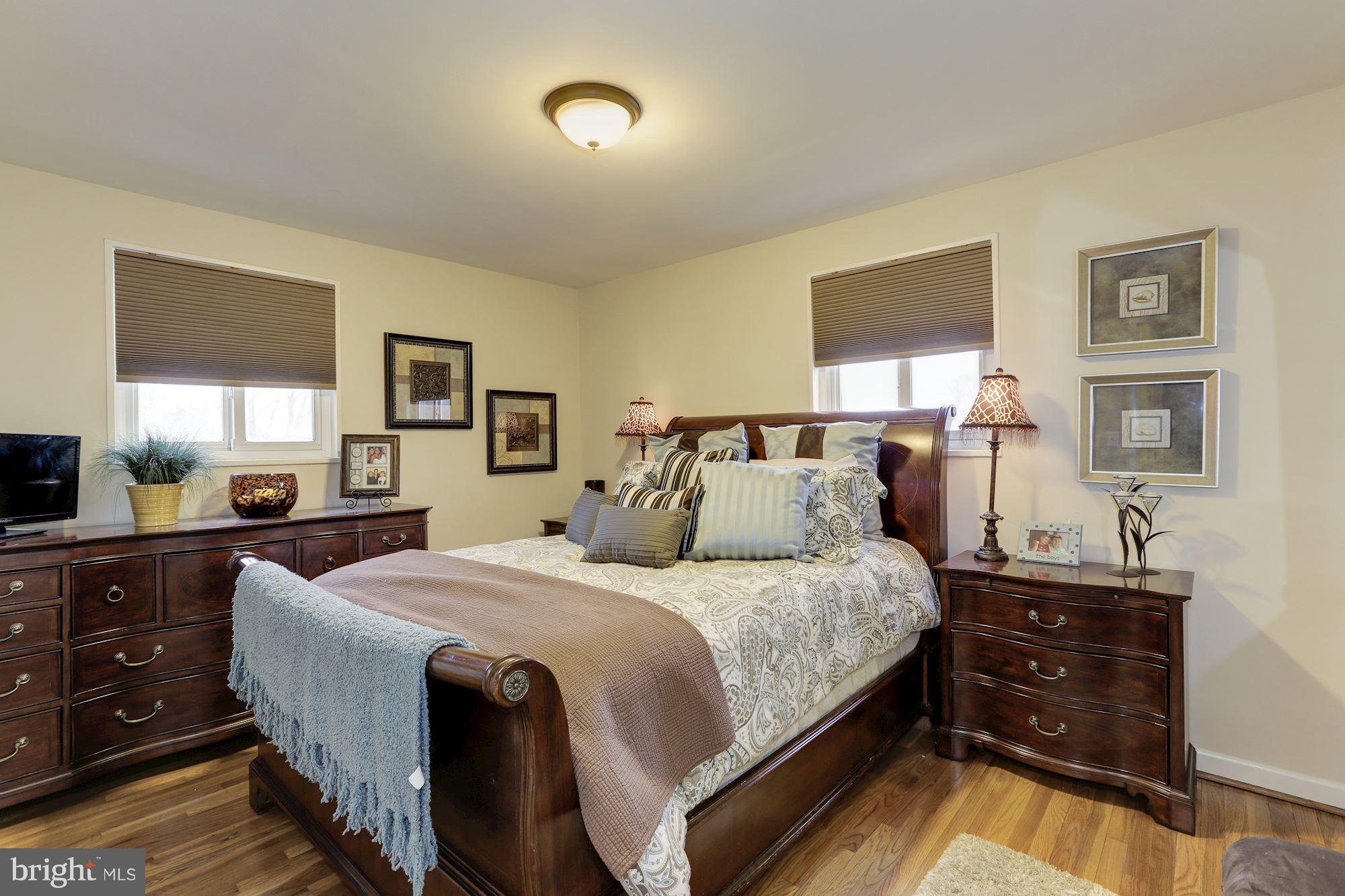 12503 Feldon Street Silver Spring, MD 20906 - Photo 10 of 18 a bedroom with a bed and a dresser