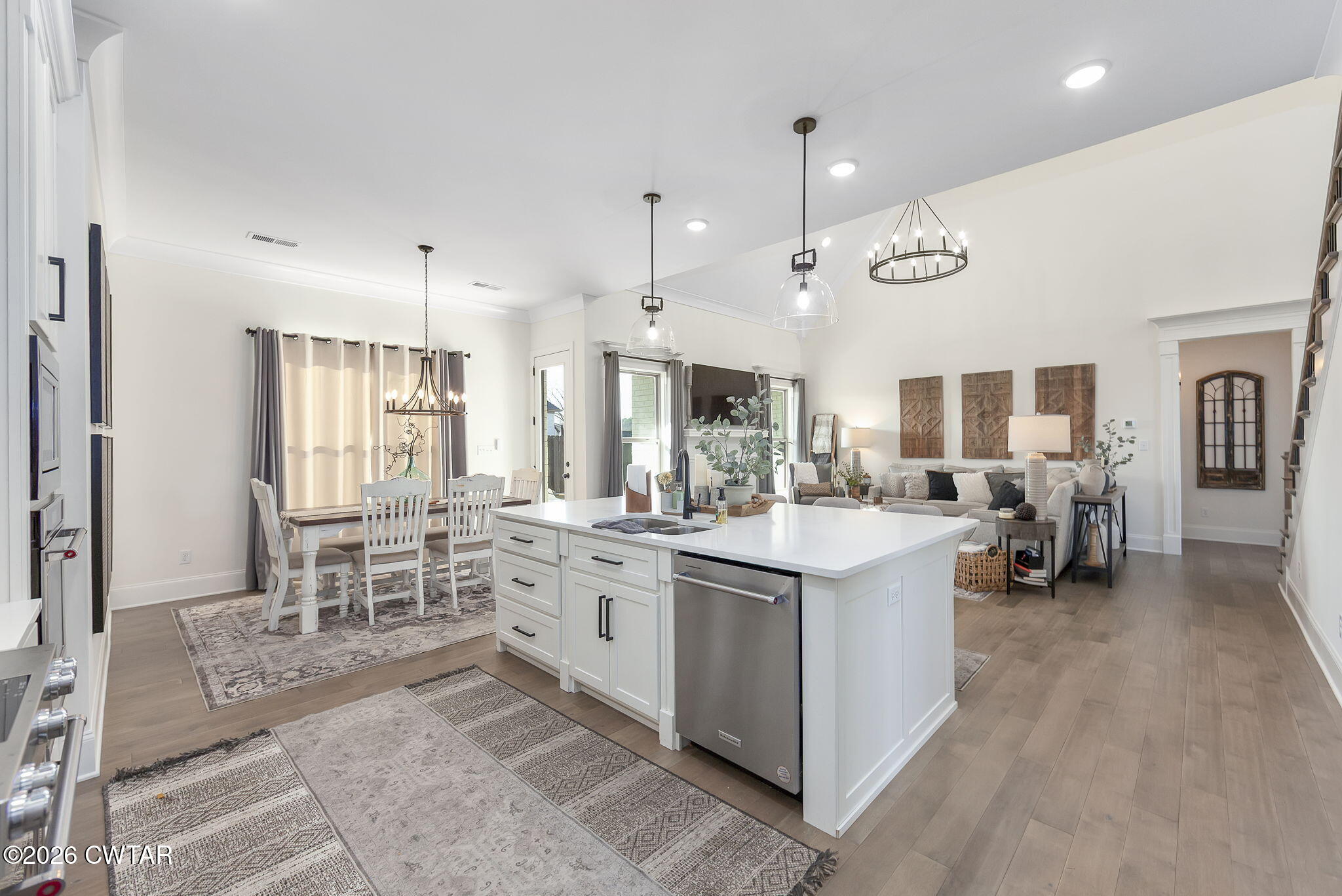 23 Clearwater Cove Jackson, TN 38305 - Photo 12 of 60 a large white kitchen with lots of counter space and chandelier