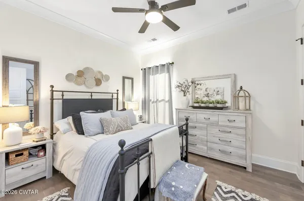 a bed room with bed and window