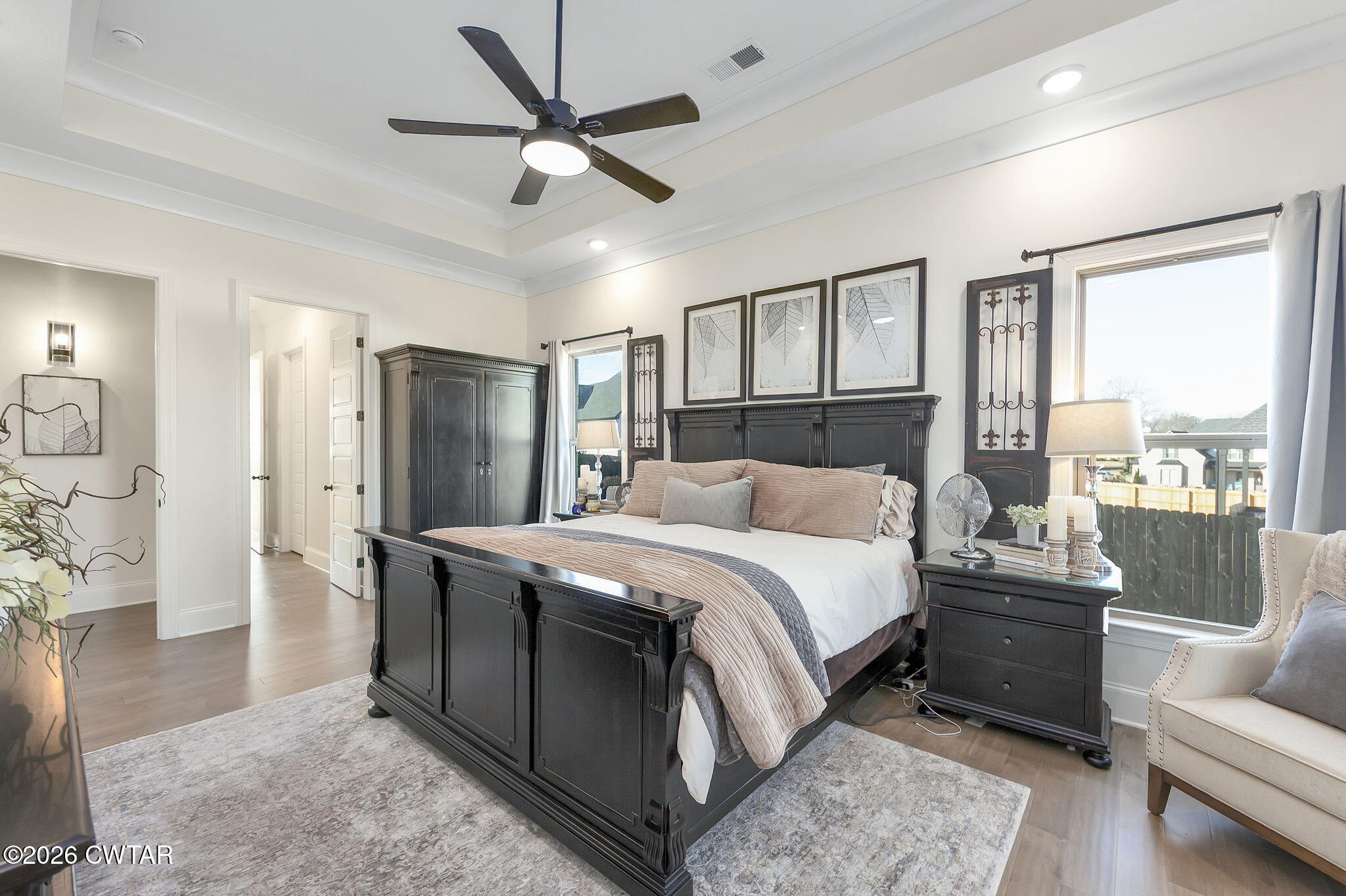 23 Clearwater Cove Jackson, TN 38305 - Photo 18 of 60 a bedroom with a bed a couch and a large window