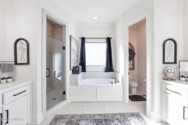 a bathroom with a tub toilet and sink