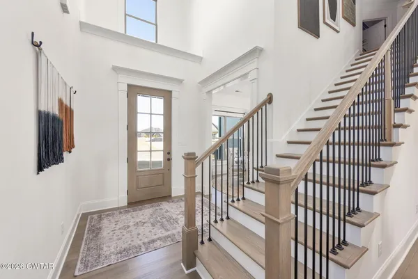 a view of staircase with wooden floor and staircase