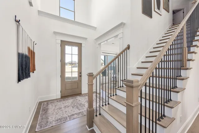 a view of staircase with wooden floor and staircase