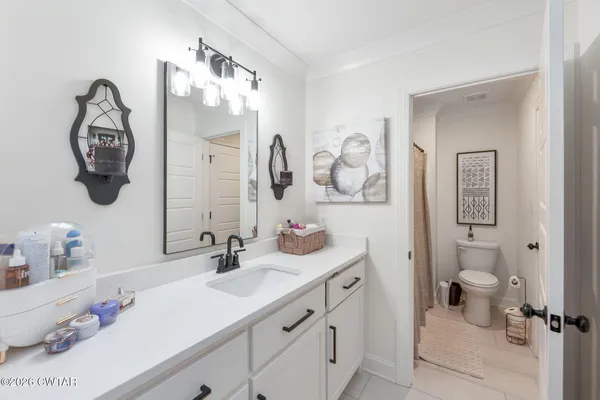 a living room with furniture or couch and a mirror