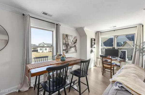 an aerial view of a house with a swimming pool