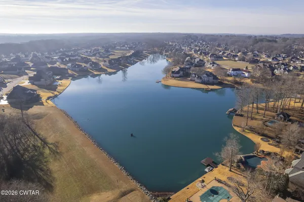 a view of a patio with a table and chairs