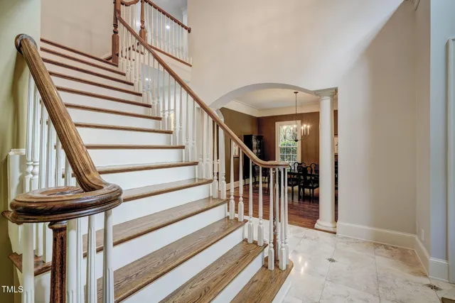a kitchen with stainless steel appliances granite countertop a sink a stove and a refrigerator