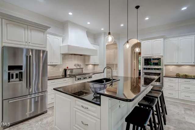 a view of a hallway with wooden floor and furniture