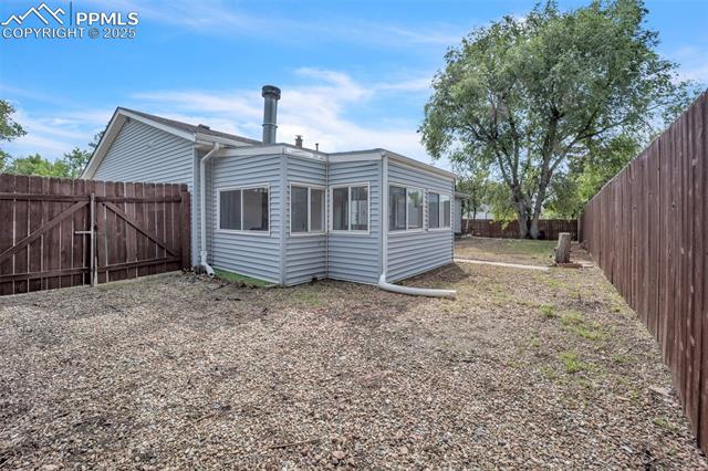 2004 Monterey Road Colorado Springs, CO 80910 - Photo 20 of 27 Back of property featuring a fenced backyard