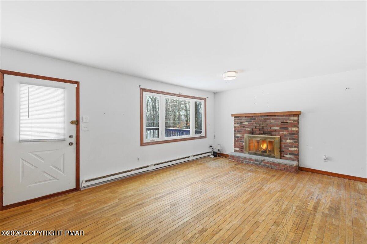 3529 Winding Way Kunkletown, PA 18058 - Photo 21 of 37 an empty room with wooden floor and windows