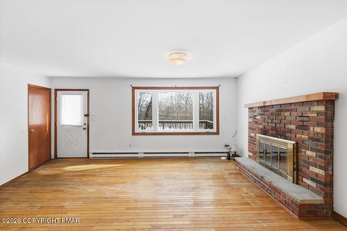 3529 Winding Way Kunkletown, PA 18058 - Photo 24 of 37 a view of empty room with a fireplace and window