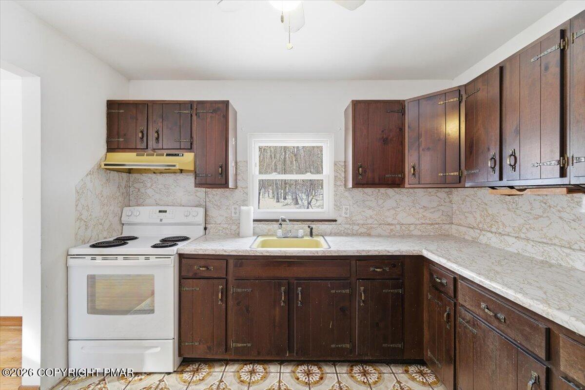 3529 Winding Way Kunkletown, PA 18058 - Photo 27 of 37 a kitchen with stainless steel appliances a sink stove and cabinets