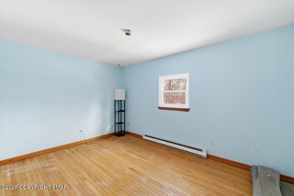 3529 Winding Way Kunkletown, PA 18058 - Photo 29 of 37 an empty room with wooden floor and windows