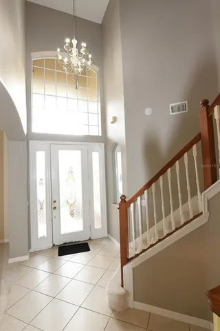 a view of an entryway with a chandelier