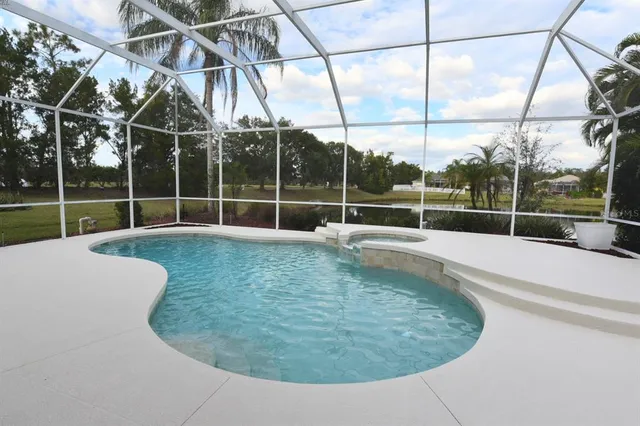 a view of a bathroom with a tub and window