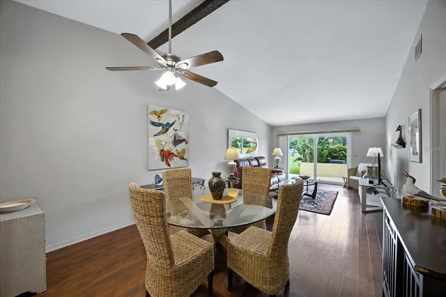 a view of a dining room with furniture and wooden floor