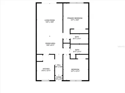 a front view of a house with garden and trees