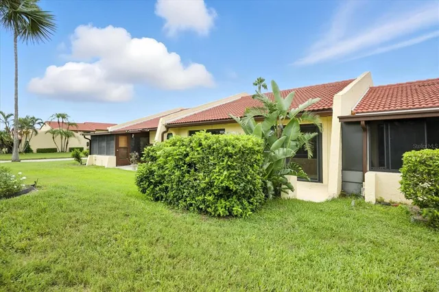 a front view of a house with a yard and porch