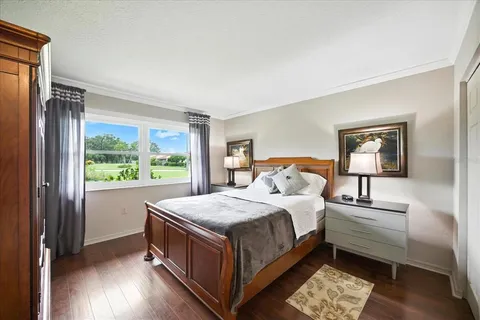 a bedroom with a bed and a night stand