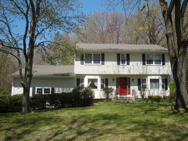32 Clover Hill Road Trumbull, CT 06611 - Photo 1 of 1 a front view of a house with a garden