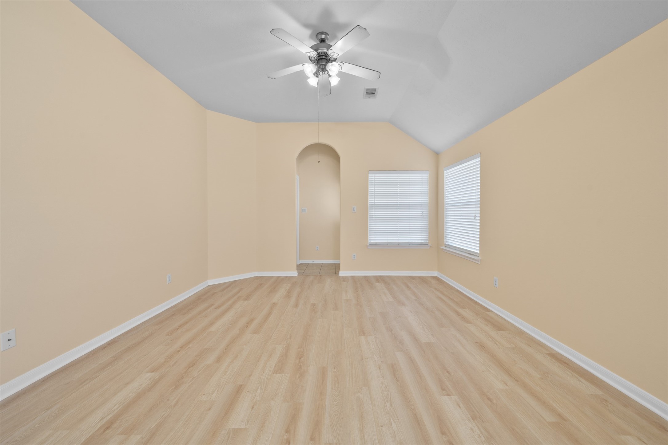 12119 Lakewood Villa Drive Tomball, TX 77377 - Photo 7 of 19 a view of empty room with wooden floor and fan
