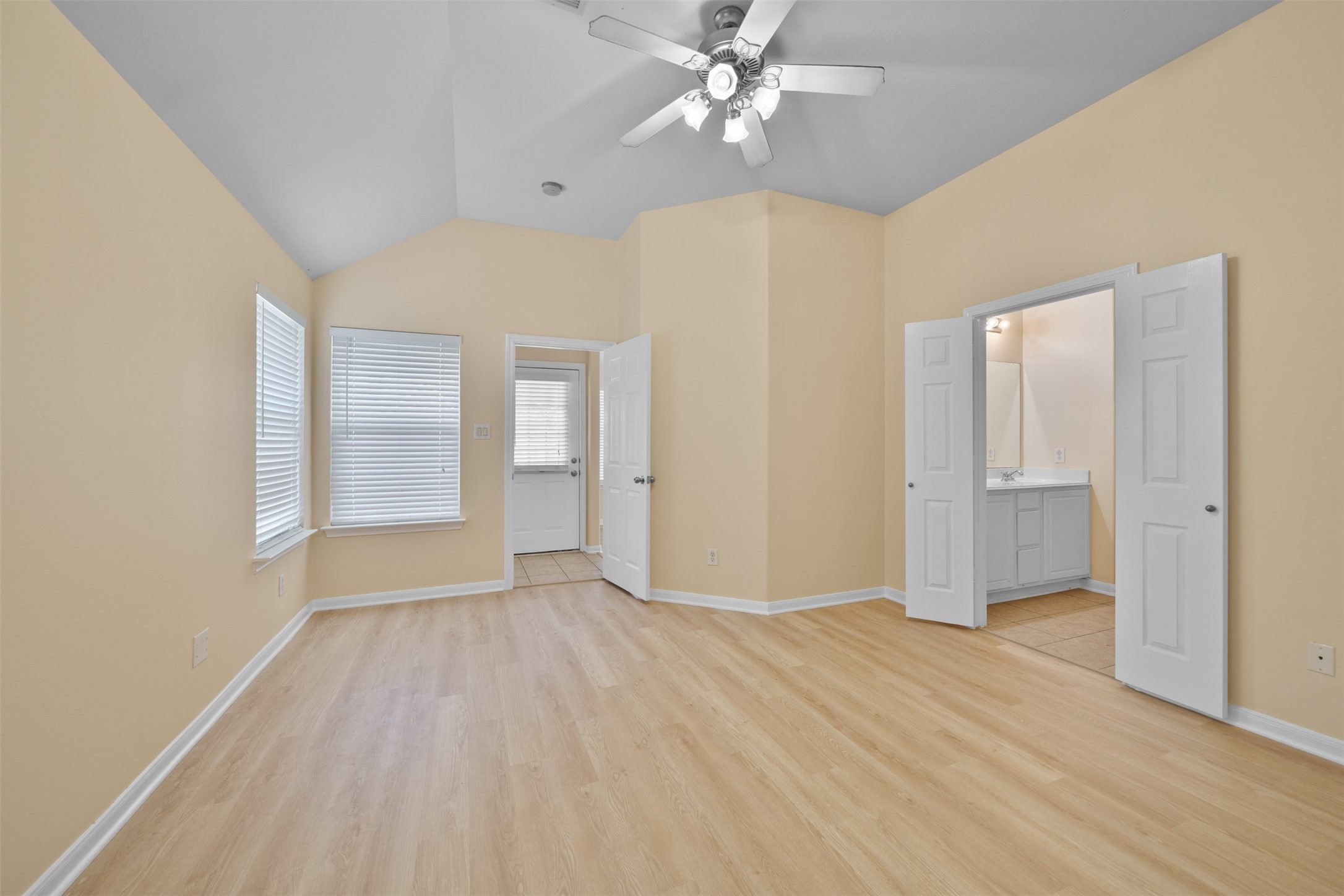 12119 Lakewood Villa Drive Tomball, TX 77377 - Photo 9 of 19 wooden floor in an empty room with a window