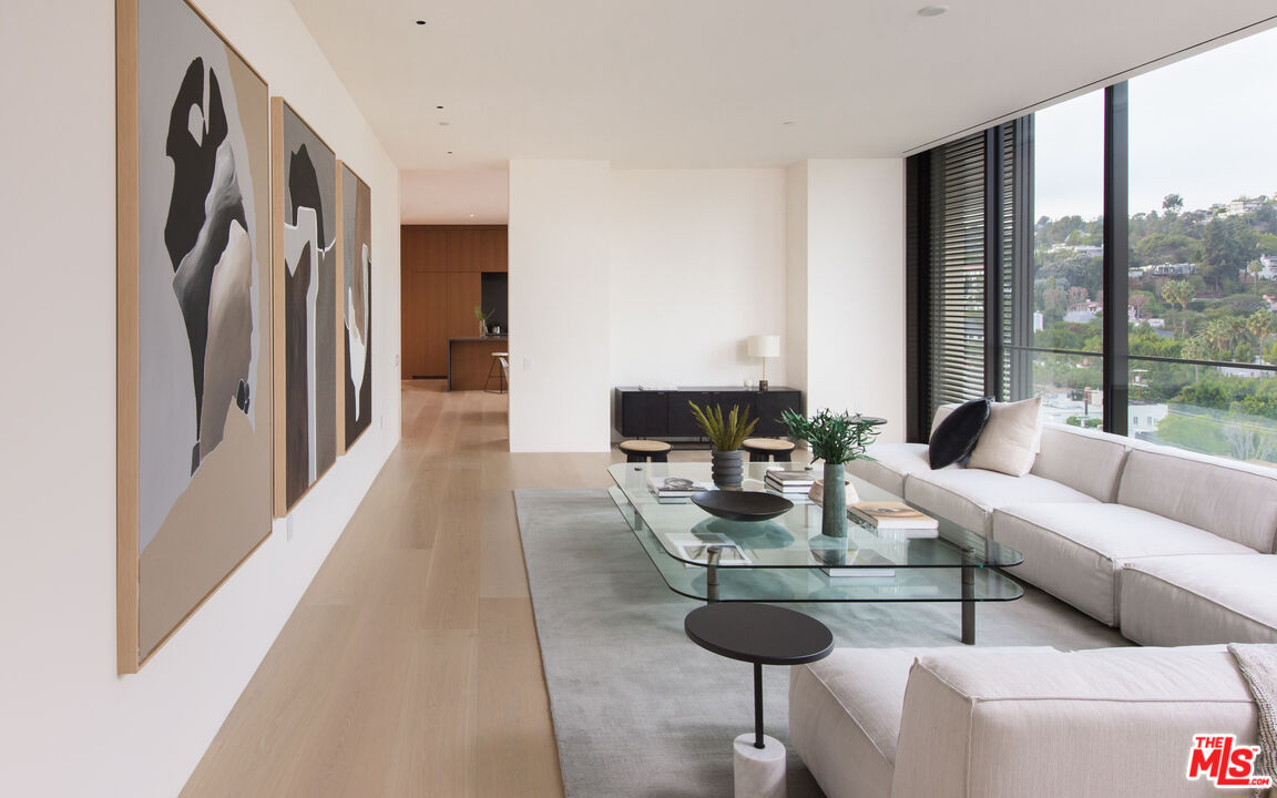 9040 Sunset Boulevard, Unit PHA West Hollywood, CA 90069 - Photo 12 of 30 a living room with furniture a large window and a table