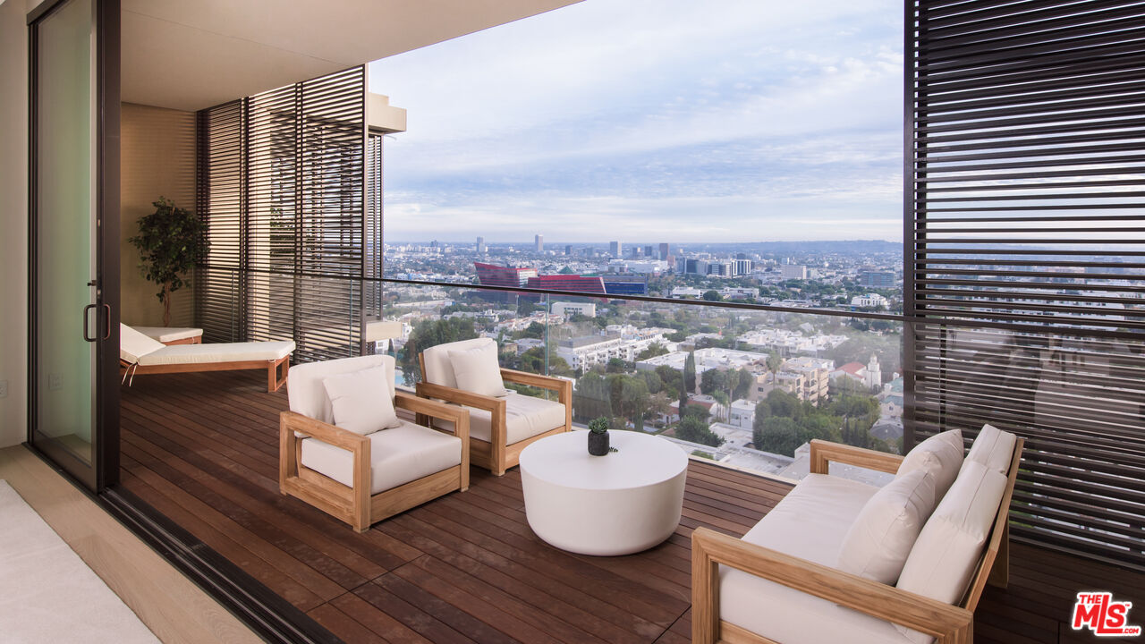9040 Sunset Boulevard, Unit PHA West Hollywood, CA 90069 - Photo 16 of 30 a view of a roof deck with couches and potted plants