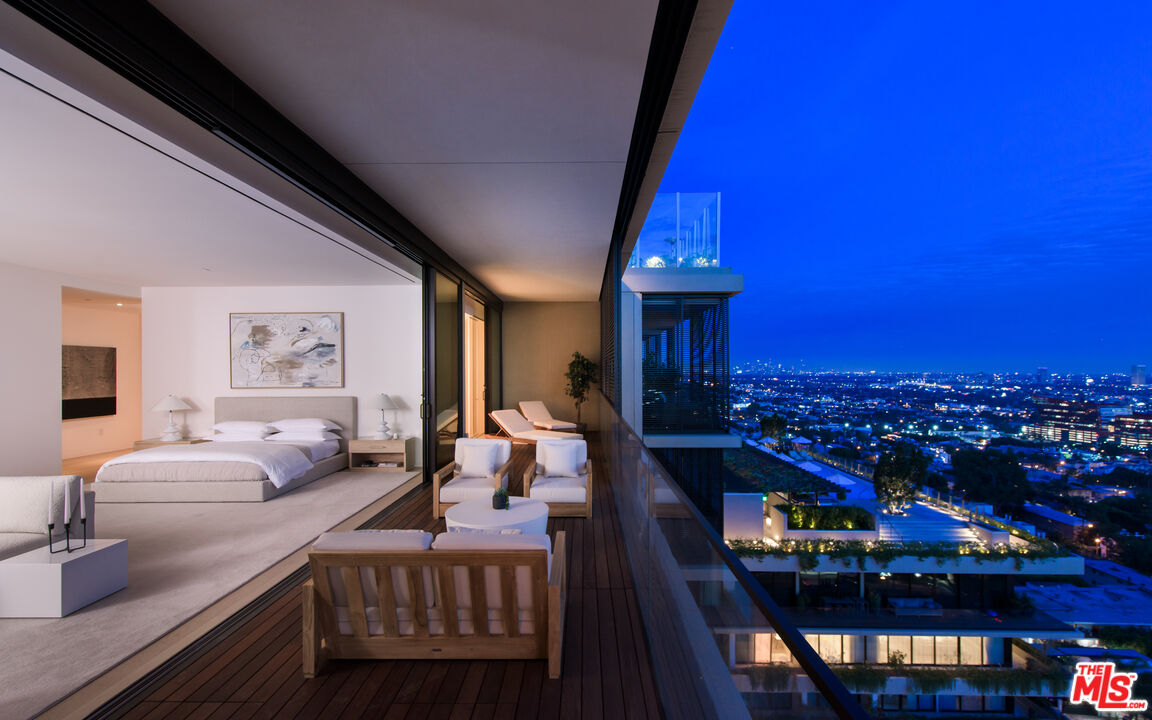 9040 Sunset Boulevard, Unit PHA West Hollywood, CA 90069 - Photo 18 of 30 a view of a dining room with furniture and chandelier