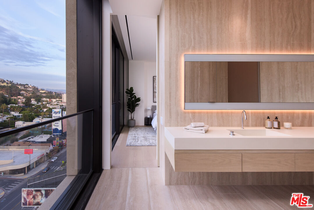 9040 Sunset Boulevard, Unit PHA West Hollywood, CA 90069 - Photo 25 of 30 a bathroom with a sink and a mirror