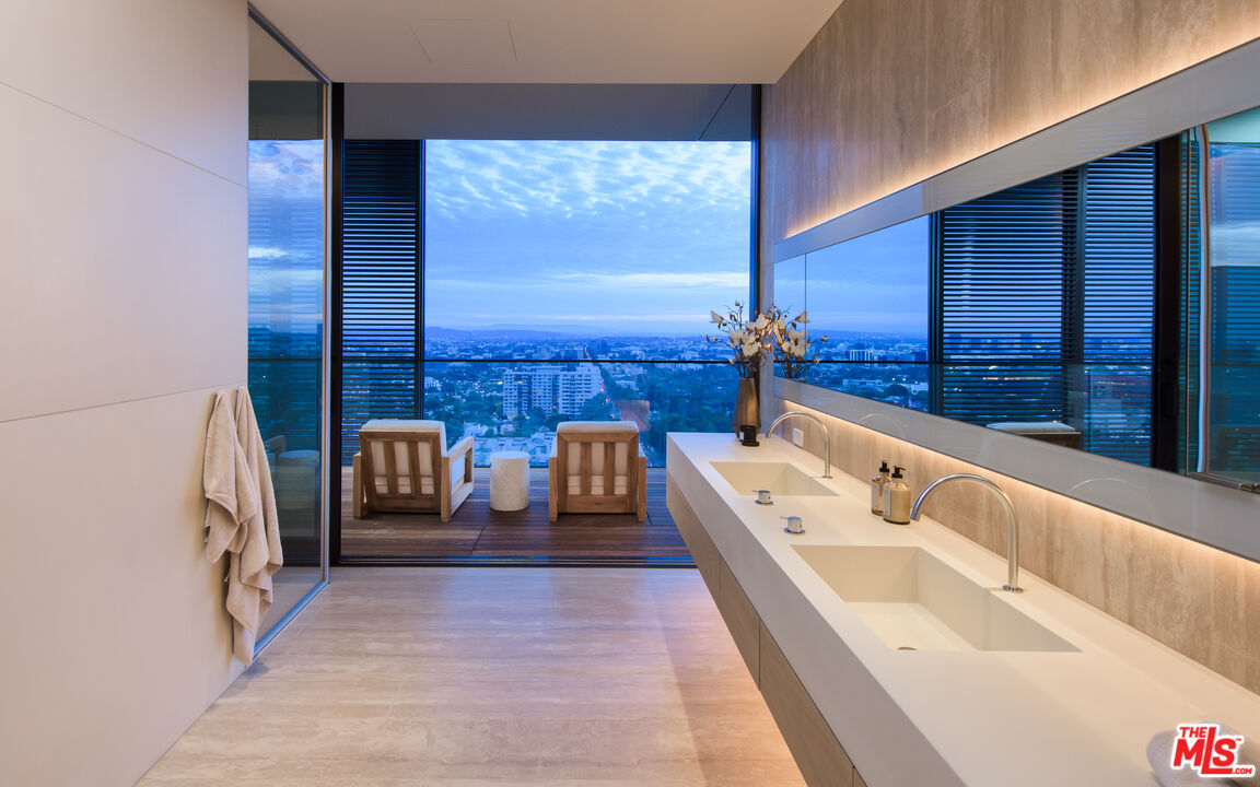 9040 Sunset Boulevard, Unit PHA West Hollywood, CA 90069 - Photo 26 of 30 a bathroom with a tub sink and mirror