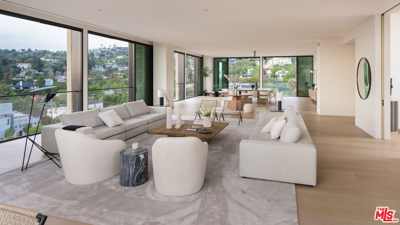 9040 Sunset Boulevard, Unit PHA West Hollywood, CA 90069 - Photo 5 of 30 a living room with fireplace furniture and a large window
