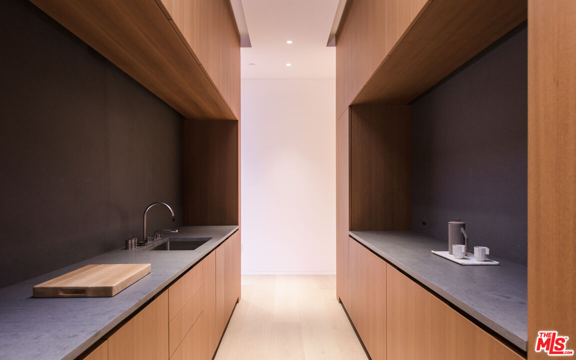 9040 Sunset Boulevard, Unit PHA West Hollywood, CA 90069 - Photo 10 of 30 a hallway with a sink and mirror